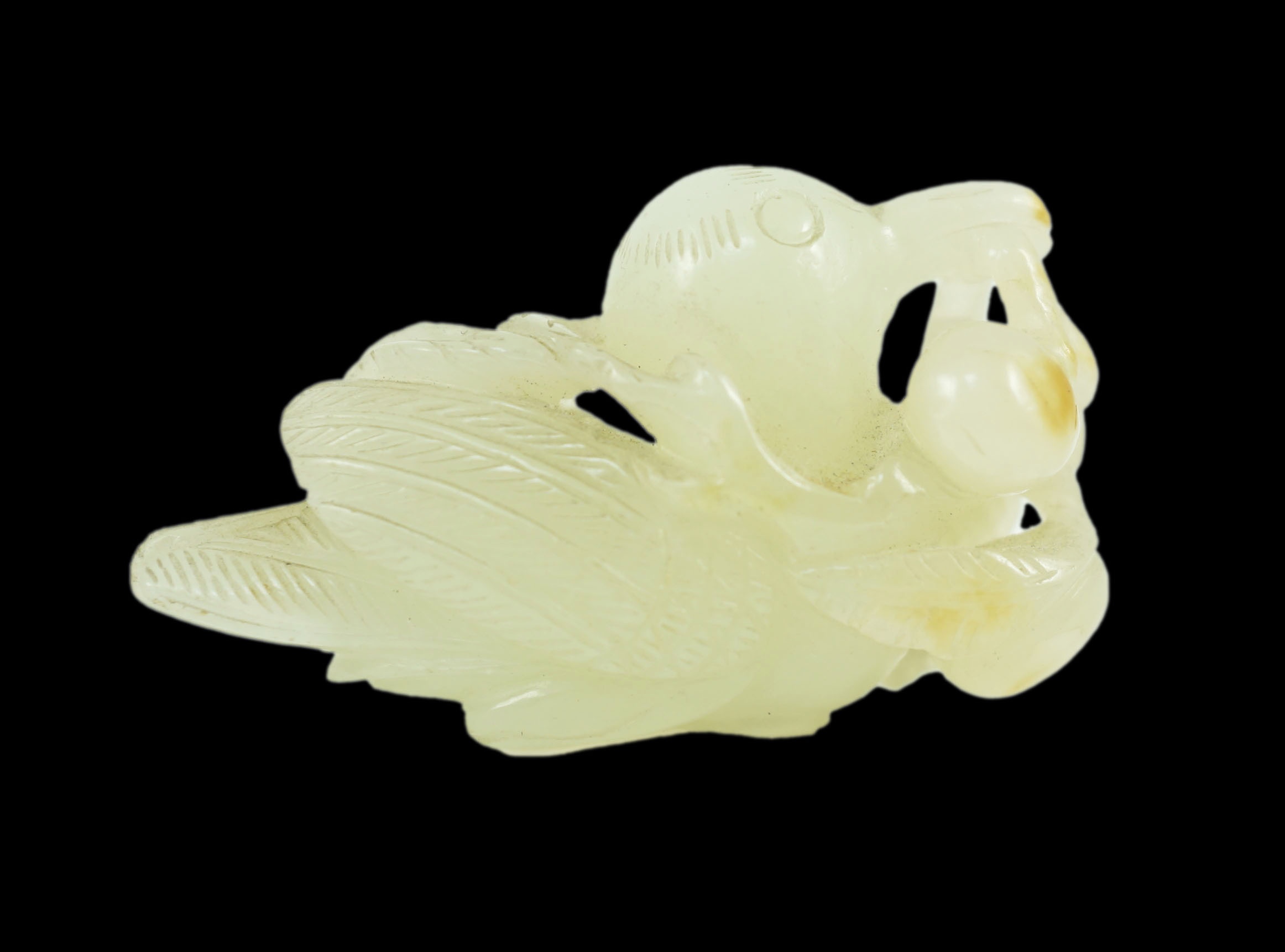 A Chinese pale celadon jade figure of a bird grasping a fruit sprig, 18th/19th century, 5.1 cm long